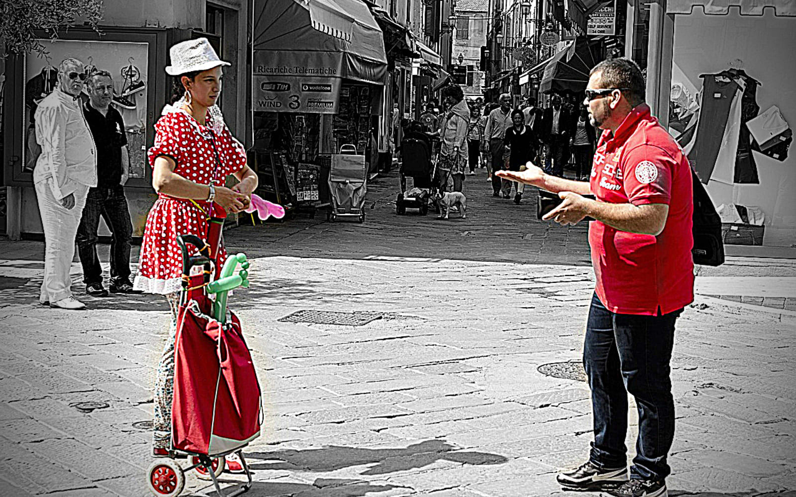 Man and woman talking in the streets.
